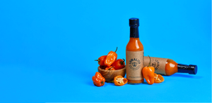 Habanero hot sauce bottle with habanero peppers